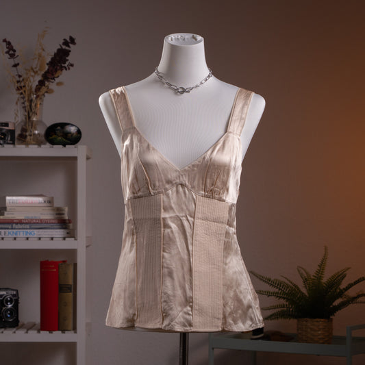 Archival Max Mara 90s Y2K Liquid Silk Satin Sculptural Bustier Top – soft apricot champagne silk satin with structured boning panels at midriff, V-neckline, wide shoulder straps, flared peplum hem, minimalist old money aesthetic, product shot on dress form