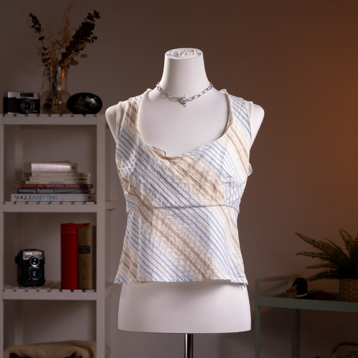 Archival Prada Linea Rossa SS2004 Ticker Stripe Cowl Neck Top – ivory cream lightweight cotton, bias-cut diagonal multi-directional ticker stripe print in pale blue and taupe, draped cowl neckline with ruffled edge, sleeveless, empire seam with zip at hem, cropped silhouette, rare red Prada Linea Rossa logo label, IT 46 EU 38 M, product shot on dress form