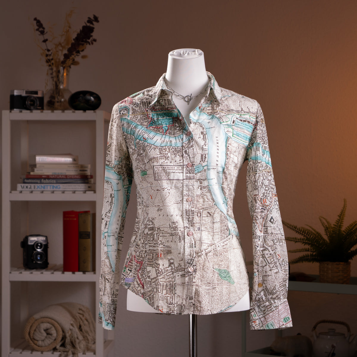 Archival Paul Smith Black Label NOS London Cartography Map Print Blouse – cream Italian cotton with all-over vintage London street map print in teal, blue, red and black, point collar, button-front, long sleeves with button cuffs, fitted silhouette, product shot on dress form