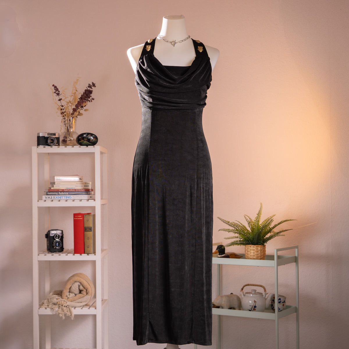 Archival Joseph Ribkoff 80s Liquid Acetate Slinky Mask Gown – black liquid acetate halterneck maxi dress with draped cowl neckline, gold shield-shaped hardware at shoulders, body-con silhouette, open back, Greek goddess aesthetic, Made in Canada, product shot on dress form