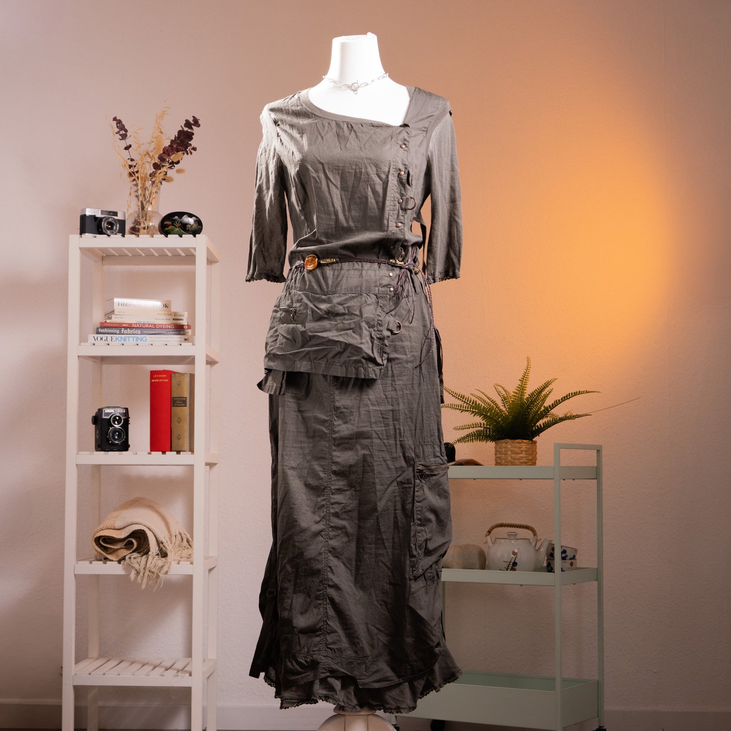 Archive Cop Copine "Pontivy" 90s French Avant-Garde Utility Gown – gunmetal grey cotton taffeta maxi dress with asymmetric square neckline, three-quarter sleeves with button detail, trompe l'oeil layered cargo pocket skirt with drawstring ruching, original amber resin belt, ruffled hem, product shot on dress form