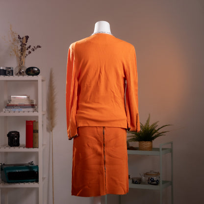 back view Archival Gianni Versace 1990s 3-Piece Cyber Futuristic Knit Set – saturated neon orange fine knit, crossover wrap V-neckline top with single gold Versace Medusa button, ruched side seam detail, long sleeves; matching midi pencil skirt with snake-embossed leather trim waistband; Gilmar BVM label, futuristic skirt suit, product shot on dress form
