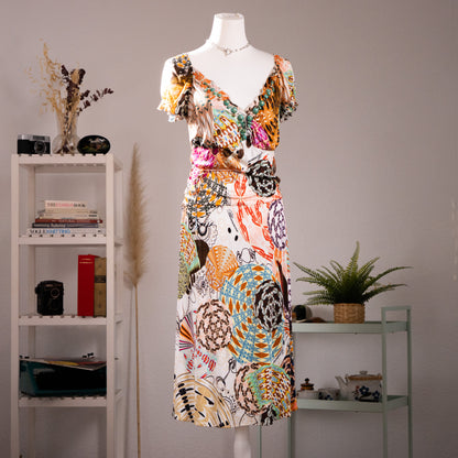 Archival Blumarine SS 2004 Jeweled Print Midi Dress by Anna Molinari – cream 100% rayon jersey with all-over trompe l'oeil jewel and ornament print in turquoise, orange, pink and brown, deep V-neckline with ruffled flutter sleeves and turquoise cabochon bead trim, wrap-style bodice, gathered waist, midi length, product shot on dress form