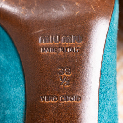 A clear, detailed close-up of the genuine leather outsole branding. The text reads "MIU MIU MADE IN ITALY" embossed directly into the leather, followed by the stamped size "38 ½" and the Italian material certification "VERO CUOIO".