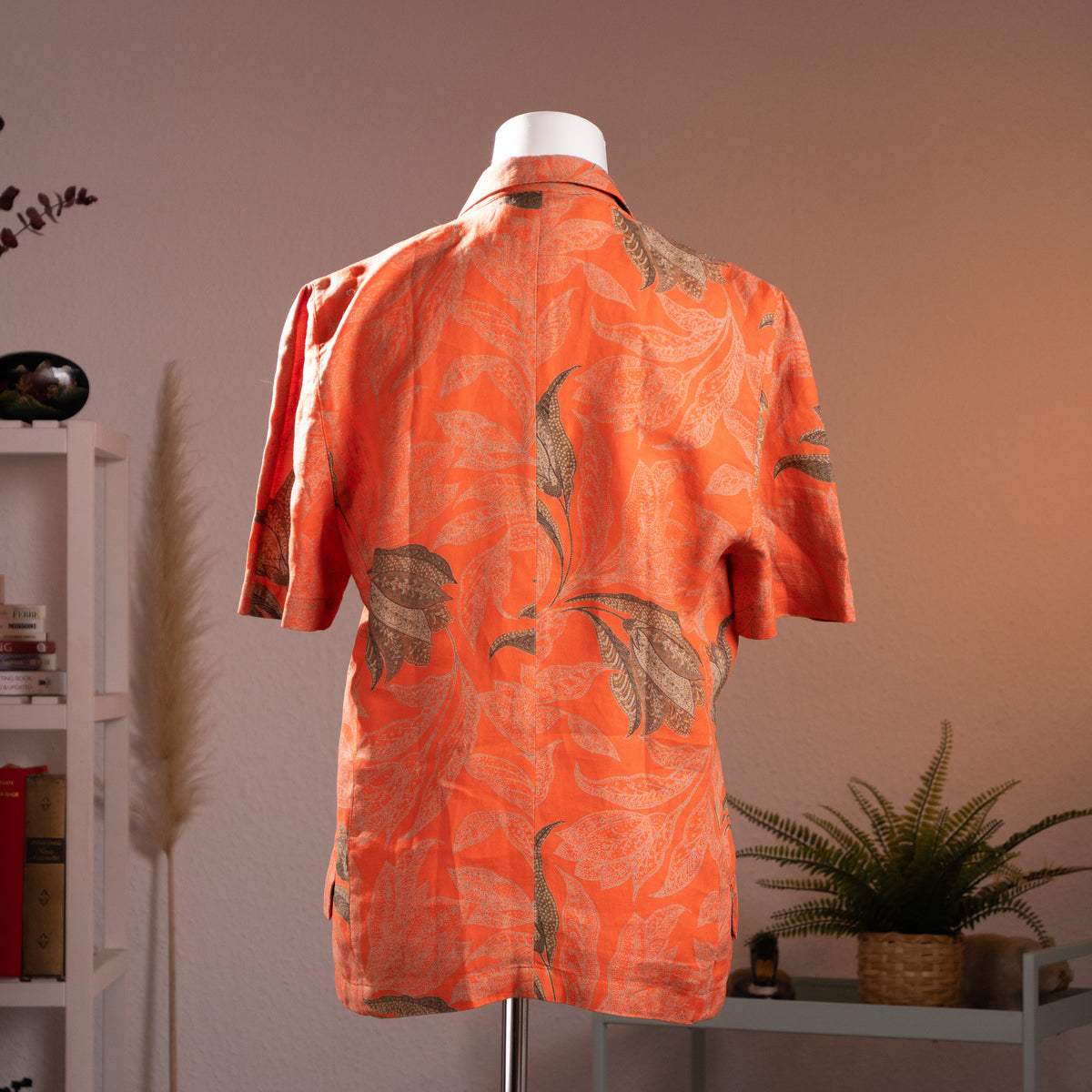 Rear view of the vintage Gianni Versace for Genny printed linen jacket showcasing the relaxed silhouette and botanical pattern symmetry.
