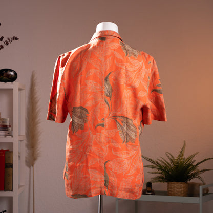 Rear view of the vintage Gianni Versace for Genny printed linen jacket showcasing the relaxed silhouette and botanical pattern symmetry.
