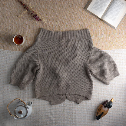 back view Cop Copine Archival Y2K Heavy Cotton Knit Bolero Shrug – warm taupe greige chunky open-weave cotton knit, wide draped lapels with sculptural wave edge, single large purple resin button closure, ribbed back yoke and collar, three-quarter sleeves, avant-garde French designer lagenlook, flat lay editorial shot