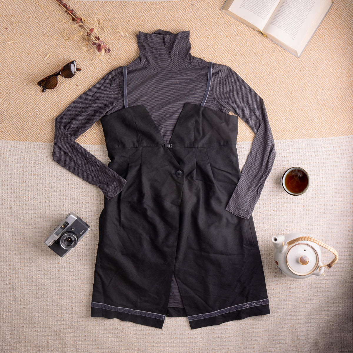 Archival Cop Copine 90s Layered 2-Piece Dress Set – charcoal grey micro-stripe cotton-viscose blend turtleneck long-sleeve top with white contrast topstitching; black cotton pinafore dress with V-neckline, single button waist closure, two front patch pockets, contrast white topstitching at hem and "Cop Copine" script embroidery, French avant-garde grunge fairycore, flat lay editorial shot