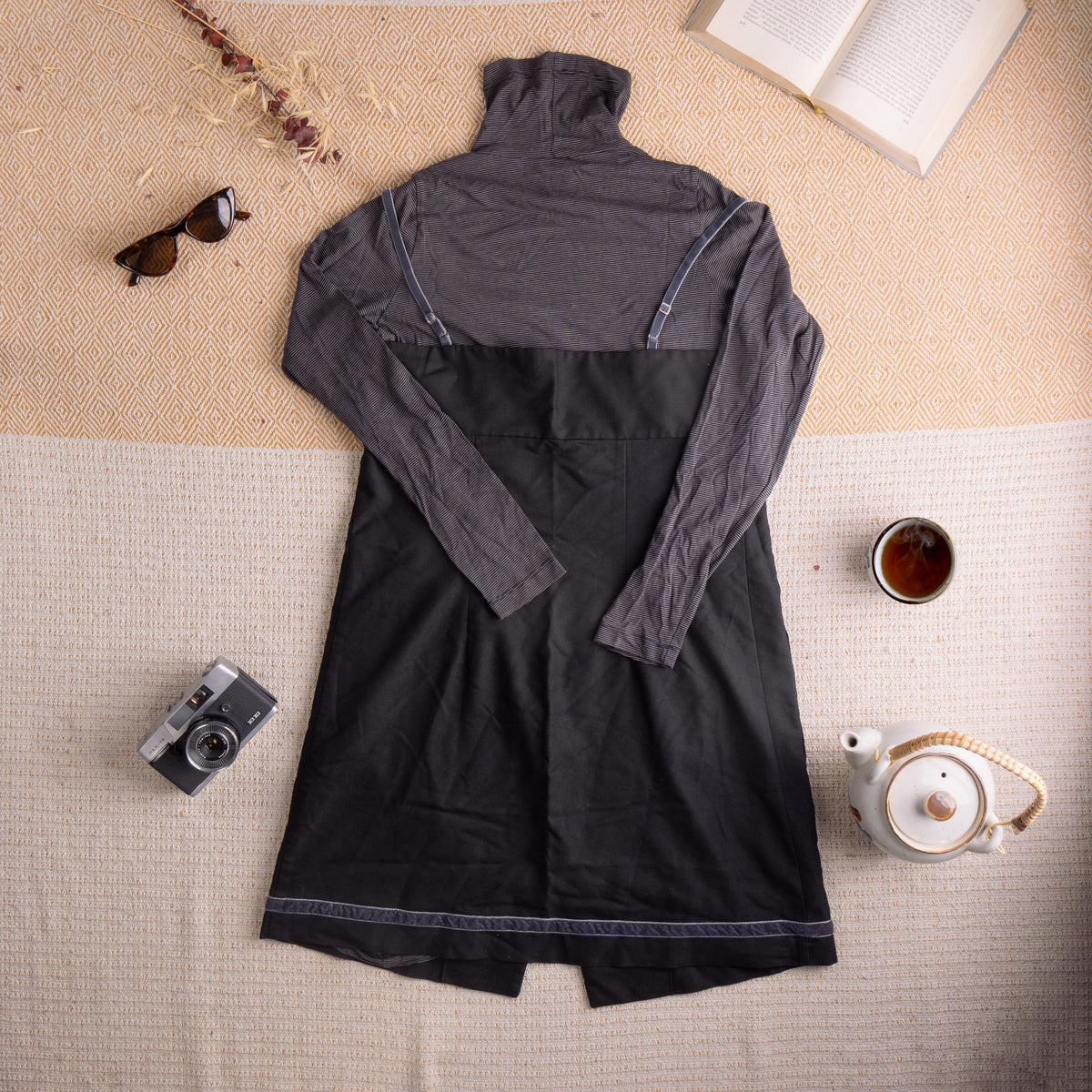 back view Archival Cop Copine 90s Layered 2-Piece Dress Set – charcoal grey micro-stripe cotton-viscose blend turtleneck long-sleeve top with white contrast topstitching; black cotton pinafore dress with V-neckline, single button waist closure, two front patch pockets, contrast white topstitching at hem and "Cop Copine" script embroidery, French avant-garde grunge fairycore, flat lay editorial shot