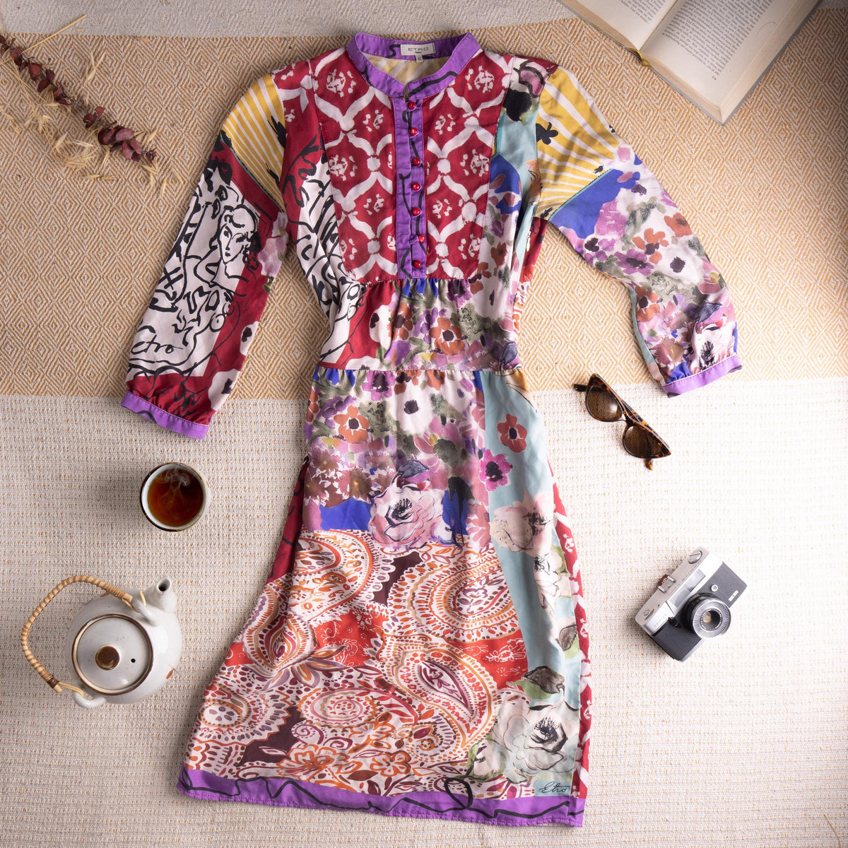 Museum Piece Archival Etro Milano S/S 2003 Silk Patchwork Midi Dress – pure silk, maximalist mixed-print patchwork combining crimson Moorish tile motif, abstract face line drawing, watercolour floral, yellow stripe, paisley and blue abstract panels, purple contrast trim at collar, cuffs and hem, hand-blown red glass buttons at placket, gathered empire waist, long sleeves, rare runway archive IT 42, flat lay editorial shot
