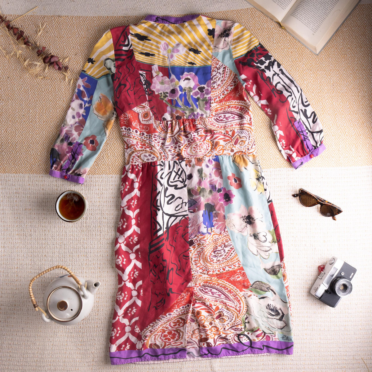 back view Museum Piece Archival Etro Milano S/S 2003 Silk Patchwork Midi Dress – pure silk, maximalist mixed-print patchwork combining crimson Moorish tile motif, abstract face line drawing, watercolour floral, yellow stripe, paisley and blue abstract panels, purple contrast trim at collar, cuffs and hem, hand-blown red glass buttons at placket, gathered empire waist, long sleeves, rare runway archive IT 42, flat lay editorial shot