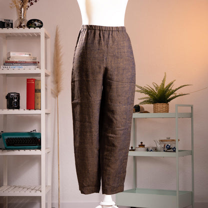 Archival Pierre Balmain Boutique 90s Linen Trousers – dark brown melange linen with subtle flecked texture, elasticated high waist, relaxed tapered leg, side pockets, cropped ankle length, product shot on dress form