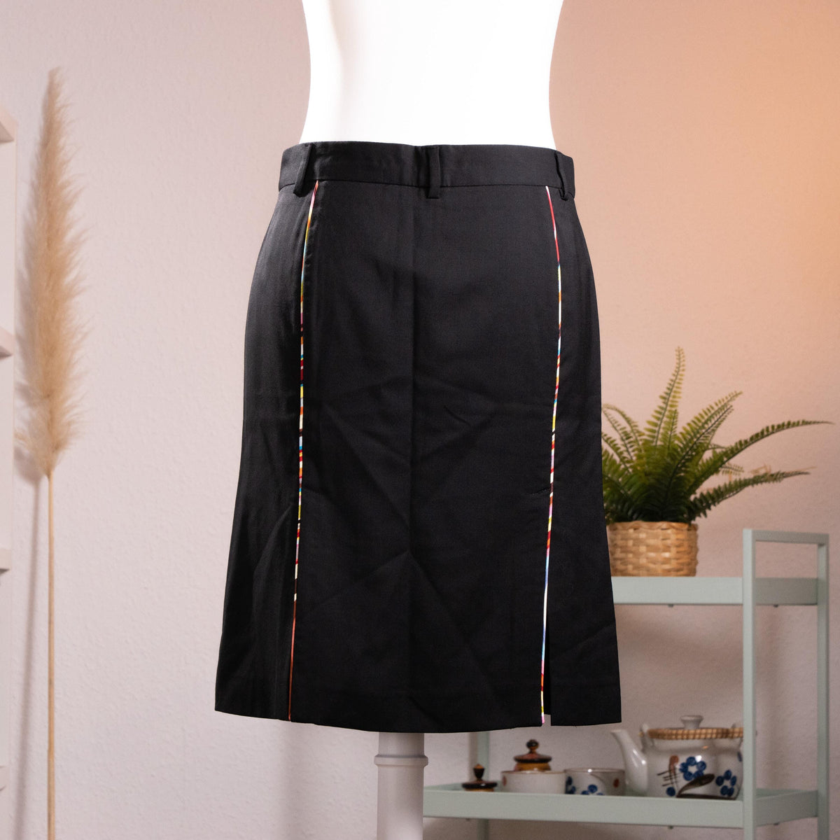 back view NOS Archival Paul Smith Black Label Merino Wool Pencil Skirt – jet black fine merino wool, high waist with belt loops and hook-and-bar closure, signature Paul Smith multicolour rainbow stripe trim along dual front kick-split vents, straight pencil silhouette, NOS deadstock, Made in Italy, product shot on dress form