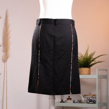 back view NOS Archival Paul Smith Black Label Merino Wool Pencil Skirt – jet black fine merino wool, high waist with belt loops and hook-and-bar closure, signature Paul Smith multicolour rainbow stripe trim along dual front kick-split vents, straight pencil silhouette, NOS deadstock, Made in Italy, product shot on dress form