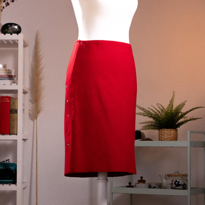 Archival Jil Sander Mainline 90s Red Wool Cashmere Pencil Skirt – lipstick red fine wool-cashmere blend, high waist with curved saddle yoke seaming, five silver snap buttons down the side slit, straight midi pencil silhouette, minimalist German precision tailoring, Made in Germany, product shot on dress form