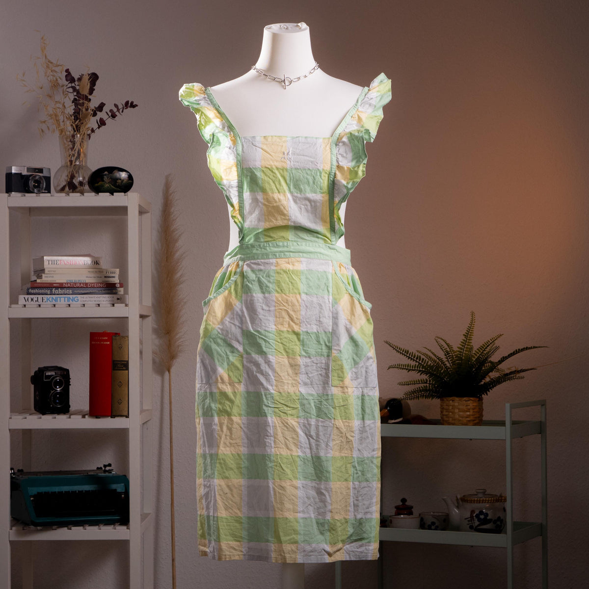 Archival Courrèges Paris 80s Japan License Metallic Lurex Gingham Pinafore Dress – oversized pastel check in mint green, butter yellow and white with metallic lurex shimmer, ruffled flutter shoulder straps, square neckline, open-back tabard silhouette with tie waist, two front patch pockets, midi length, rare Japan license piece, product shot on dress form